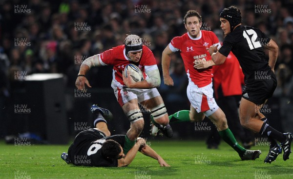 19.06.10 - New Zealand v Wales - 2010 Steinlager Series - Ryan Jones of Wales is tackled by Dan Carter of New Zealand. 