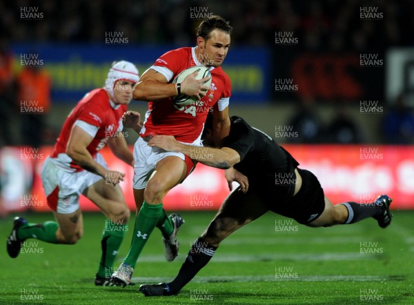 19.06.10 - New Zealand v Wales - 2010 Steinlager Series - Lee Byrne of Wales is tackled by Conrad Smith of New Zealand. 