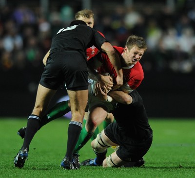 26.06.10 - New Zealand v Wales - 2010 Steinlager Series - Dan Biggar of Wales is tackled by Richard Kahui and Richie McCaw of New Zealand. 