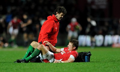 26.06.10 - New Zealand v Wales - 2010 Steinlager Series - Dan Biggar of Wales is treated for an injury by physio Mark Davies. 