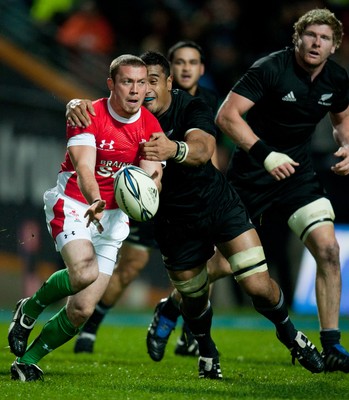 26.06.10  New Zealand v Wales... Richie Rees is tackled by Jerome Kaino 