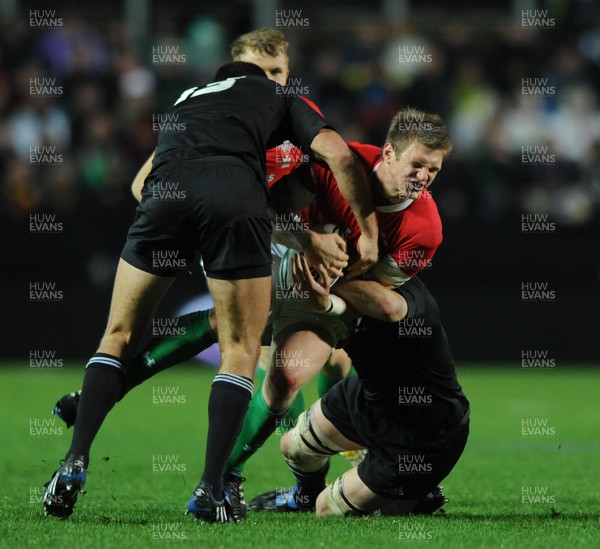 26.06.10 - New Zealand v Wales - 2010 Steinlager Series - Dan Biggar of Wales is tackled by Richard Kahui and Richie McCaw of New Zealand. 