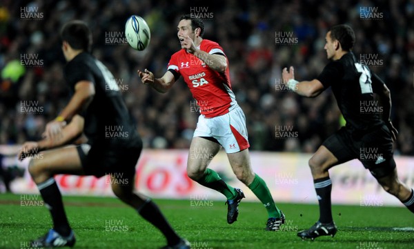 26.06.10 - New Zealand v Wales - 2010 Steinlager Series - Stephen Jones of Wales gets the ball away. 