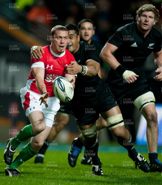 26.06.10  New Zealand v Wales... Richie Rees is tackled by Jerome Kaino 