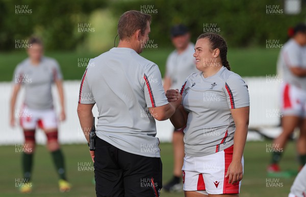 291022 - New Zealand v Wales, Women’s World Cup Quarter-Final - Wales head coach Ioan Cunningham chats with Carys Phillips of Wales during warm up