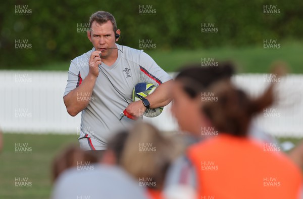 291022 - New Zealand v Wales, Women’s World Cup Quarter-Final - Wales head coach Ioan Cunningham works with the squad during warm up