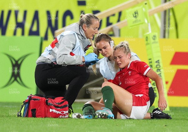 291022 - New Zealand v Wales, Women’s World Cup Quarter-Final - Medics Jo Perkins and Cara Jones attend to Megan Webb of Wales