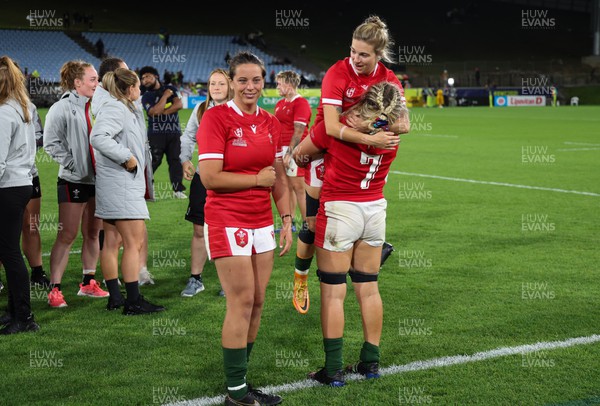 291022 - New Zealand v Wales, Women’s World Cup Quarter-Final - Sioned Harries , Keira Bevan and Alex Callender of Wales at the end of the match