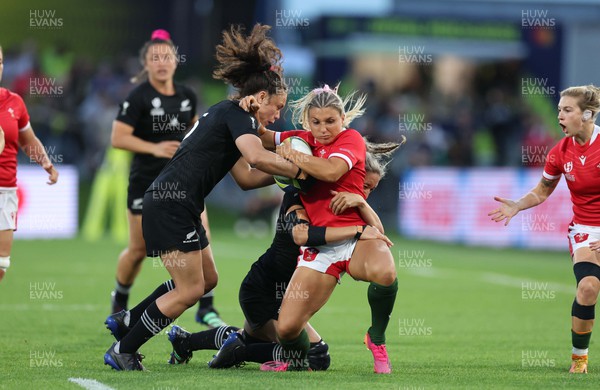 291022 - New Zealand v Wales, Women’s World Cup Quarter-Final -  Lowri Norkett of Wales is tackled by Ruby Tui and Sarah Hirini of New Zealand