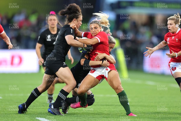 291022 - New Zealand v Wales, Women’s World Cup Quarter-Final -  Lowri Norkett of Wales is tackled by Ruby Tui and Sarah Hirini of New Zealand