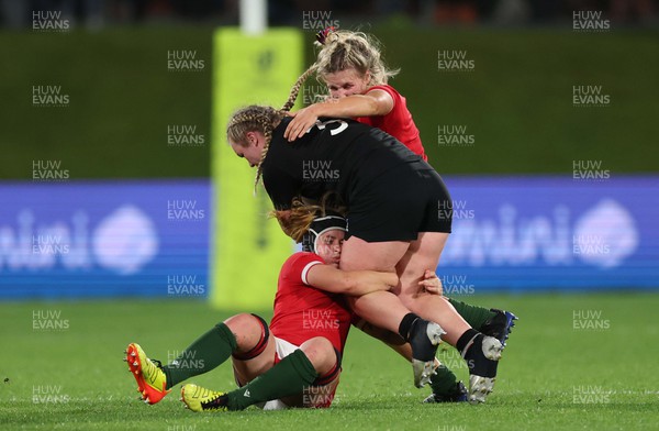 291022 - New Zealand v Wales, Women’s World Cup Quarter-Final -  Amy Rule of New Zealand is tackled by Beth Lewis and Alex Callender of Wales