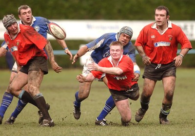 080203 - Newbridge v Bridgend - Principality Cup - Newbridge's Matthew Taylor releases as Mamma Molitika tackles