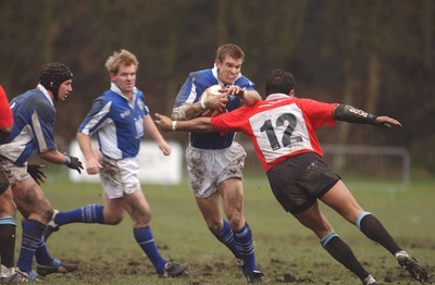 080203 - Newbridge v Bridgend - Principality Cup - Bridgend's Dafydd James is tackled by Gareth Turner