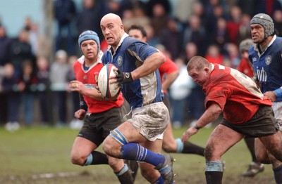 080203 - Newbridge v Bridgend - Principality Cup - Bridgend's Nathan Budgett beats tackle by Darryl Williams