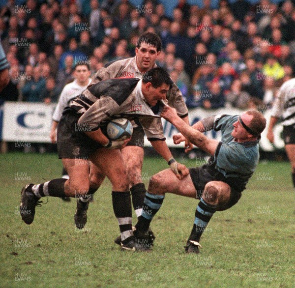 070195 - Newbridge v Pontypridd - Dale McIntosh of Pontypridd is tackled by Peter Crane