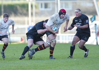 160105 - Newcastle Falcons v Newport Gwent Dragons - Heineken Cup Rugby - Dragons Ian Gough is held midfield