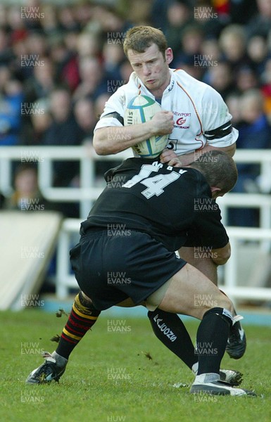 160105 - Newcastle Falcons v Newport Gwent Dragons - Heineken Cup Rugby - Dragons Kevin Morgan is stopped by Tom May