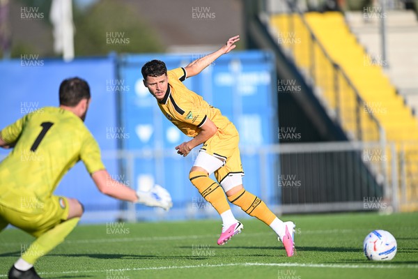 080726 - Newport City v Newport County - Pre Season Friendly - Kieron Evans of Newport County plays a cross into the box