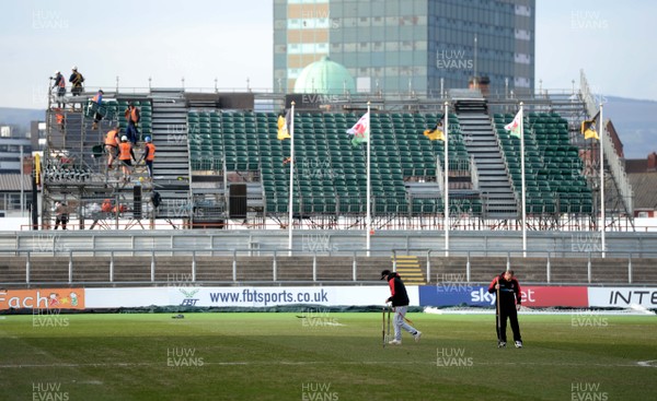 130219 - Newport County AFC Media Day - A general view of ground staff tending to the pitch at Rodney Parade, Newport