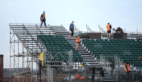130219 - Newport County AFC Media Day - A general view of workmen erecting temporary seating at Rodney Parade, Newport