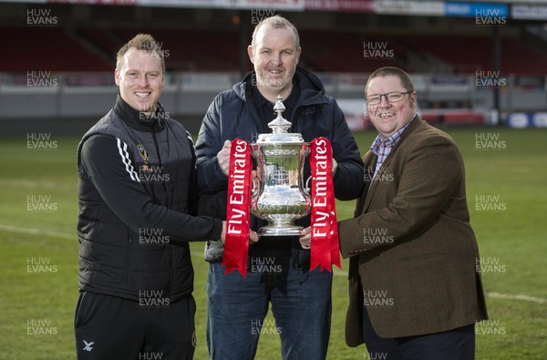 250118 - Newport County - FA Cup preview - Newport County Manager Michael Flynn, poet Sean Edwards and Chairman Gavin Foxall with the trophy