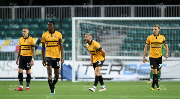 280818 - Newport County v Oxford United - Carabao Cup - Newport County players show their frustration after a Oxford United second goal