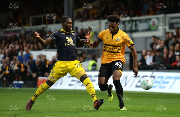 280818 - Newport County v Oxford United - Carabao Cup - Antoine Semenyo of Newport County is tackled by Shandon Baptiste of Oxford United
