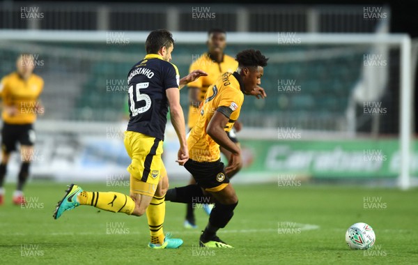 280818 - Newport County v Oxford United - Carabao Cup - Antoine Semenyo of Newport County is tackled by John Mousinho of Oxford United
