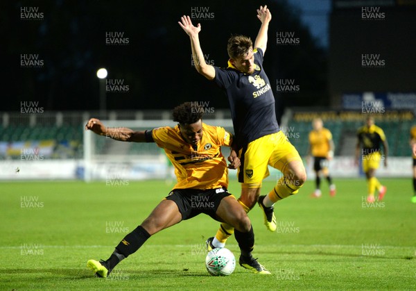 280818 - Newport County v Oxford United - Carabao Cup - Antoine Semenyo of Newport County is tackled by Jamie Hanson of Oxford United