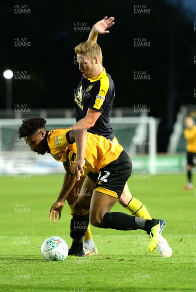 280818 - Newport County v Oxford United - Carabao Cup - Antoine Semenyo of Newport County is tackled by Cameron Norman of Oxford United