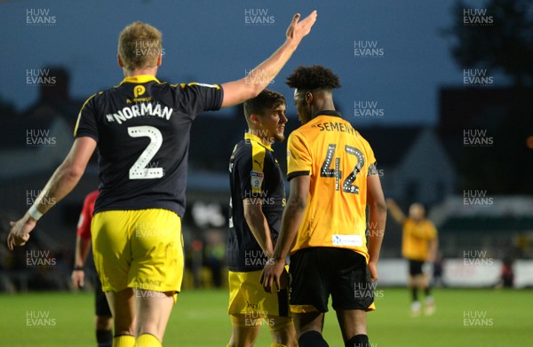 280818 - Newport County v Oxford United - Carabao Cup - Jamie Hanson of Oxford United and Antoine Semenyo of Newport County square up
