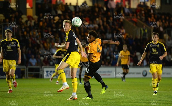 280818 - Newport County v Oxford United - Carabao Cup - Antoine Semenyo of Newport County heads the ball towards the goal