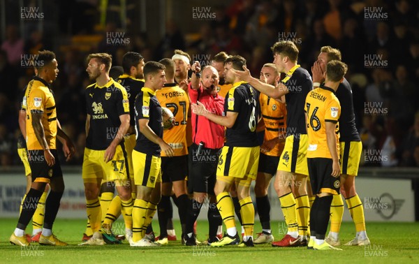 280818 - Newport County v Oxford United - Carabao Cup - Jamie Hanson (6) of Oxford United is shown a red card