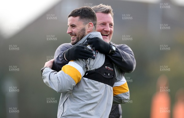 040119 - Newport County training prior to their 3rd Round FA Cup game with Leicester City - Padraig Amond of Newport County and Wayne Hatswell hug during training