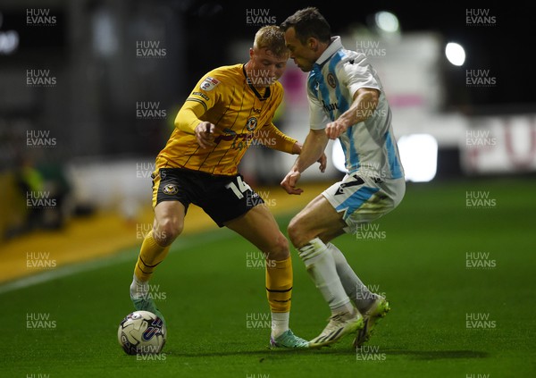 090424 - Newport County v Accrington Stanley - Sky Bet League Two - Harrison Bright of Newport County is challenged by Shaun Whalley of Accrington Stanley 