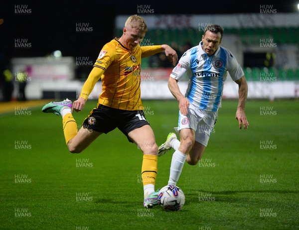 090424 - Newport County v Accrington Stanley - Sky Bet League Two - Harrison Bright of Newport County is challenged by Shaun Whalley of Accrington Stanley 