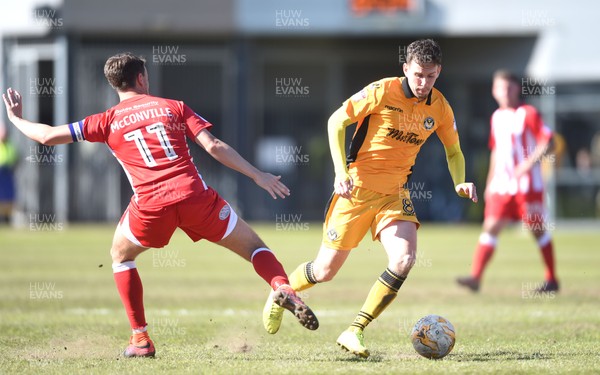 220417 - Newport County v Accrington Stanley - SkyBet League 2 - Mark Randall of Newport County is tackled by Sean McConville of Accrington Stanley