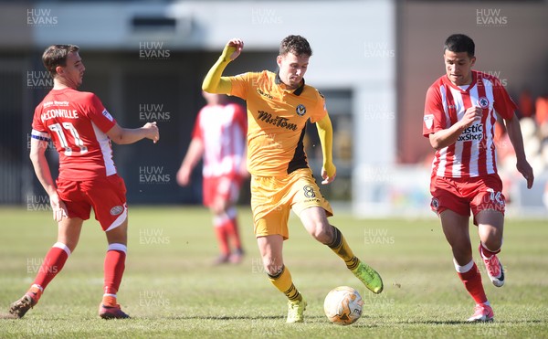 220417 - Newport County v Accrington Stanley - SkyBet League 2 - Mark Randall of Newport County is tackled by Sean McConville of Accrington Stanley