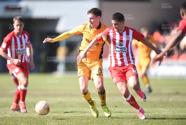 220417 - Newport County v Accrington Stanley - SkyBet League 2 - Mark Randall of Newport County is tackled by Noor Husin of Accrington Stanley