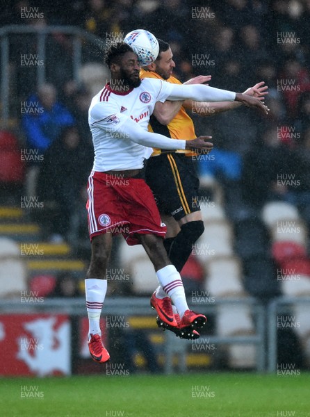 240418 - Newport County v Accrington Stanley - SkyBet League 2 - Janoi Donacien of Accrington Stanley and Robbie Willmott of Newport County compete