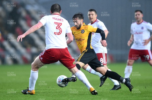 240418 - Newport County v Accrington Stanley - SkyBet League 2 - Josh Sheehan of Newport County is tackled by Mark Hughes of Accrington Stanley