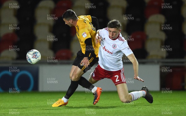 240418 - Newport County v Accrington Stanley - SkyBet League 2 - Padraig Amond of Newport County is tackled by Jimmy Dunne of Accrington Stanley