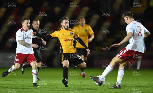 240418 - Newport County v Accrington Stanley - SkyBet League 2 - Josh Sheehan of Newport County is tackled by Jimmy Dunne of Accrington Stanley