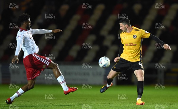 240418 - Newport County v Accrington Stanley - SkyBet League 2 - Janoi Donacien of Accrington Stanley is tackled by Padraig Amond of Newport County