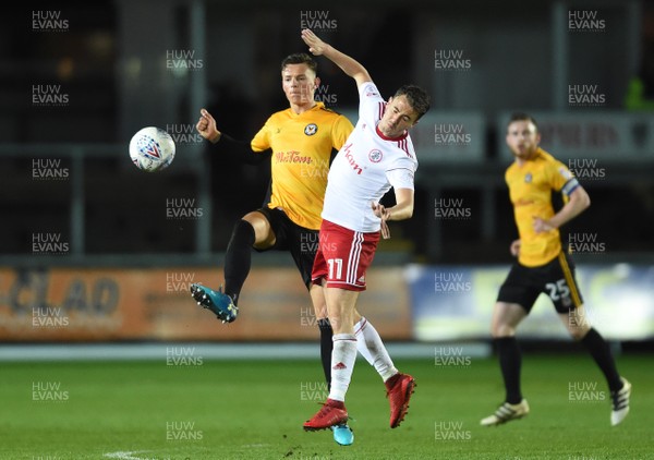 240418 - Newport County v Accrington Stanley - SkyBet League 2 - Ben White of Newport County is tackled by Sean McConville of Accrington Stanley