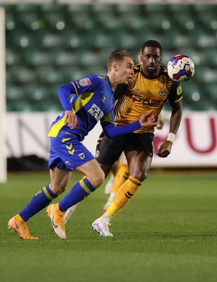 140323 - Newport County v AFC Wimbledon, EFL Sky Bet League 2 - Jack Currie of AFC Wimbledon beats Omar Bogle of Newport County to the ball