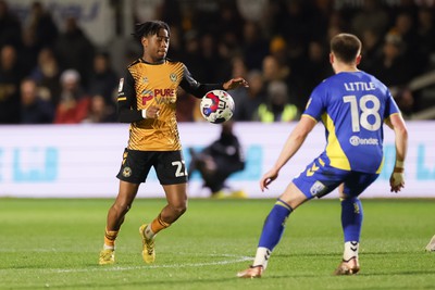 140323 - Newport County v AFC Wimbledon, EFL Sky Bet League 2 - Nathan Moriah-Welsh of Newport County takes on Armani Little of AFC Wimbledon