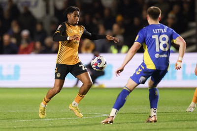 140323 - Newport County v AFC Wimbledon, EFL Sky Bet League 2 - Nathan Moriah-Welsh of Newport County takes on Armani Little of AFC Wimbledon