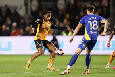 140323 - Newport County v AFC Wimbledon, EFL Sky Bet League 2 - Nathan Moriah-Welsh of Newport County takes on Armani Little of AFC Wimbledon