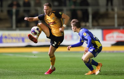 140323 - Newport County v AFC Wimbledon, EFL Sky Bet League 2 - Cameron Norman of Newport County takes on Jack Currie of AFC Wimbledon